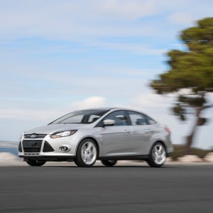 2014-Ford-Focus-Titanium-front-three-quarter-in-motion.jpg